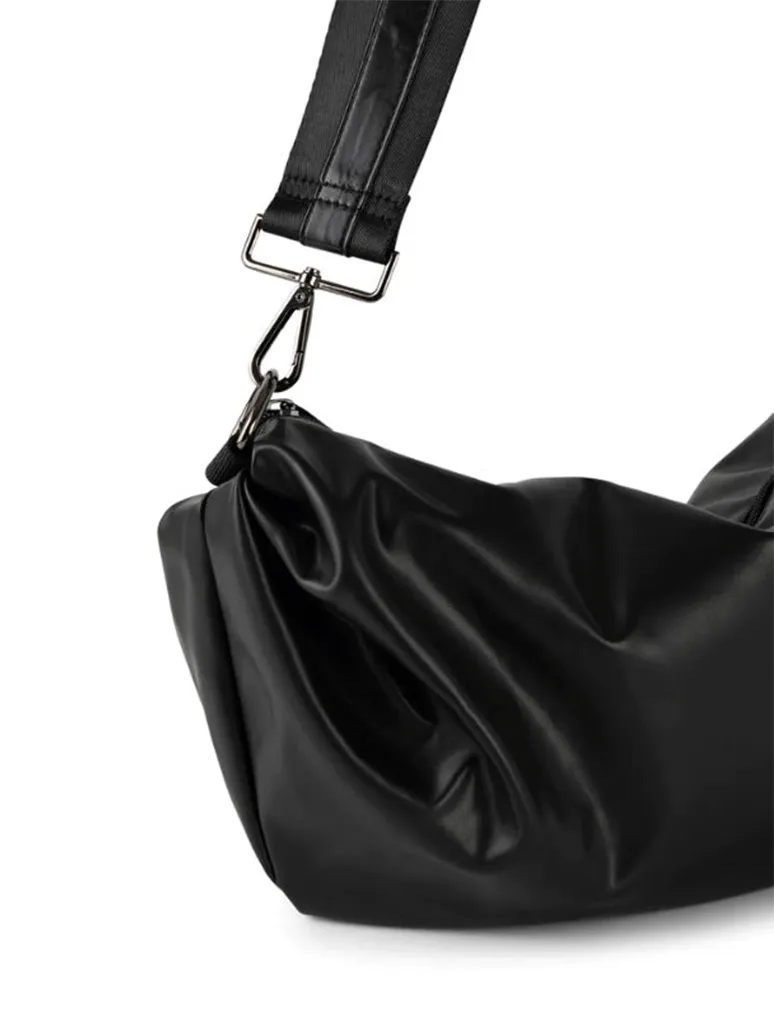 Haute Shore Ollie Solo Sling Bag in Black Faux Leather