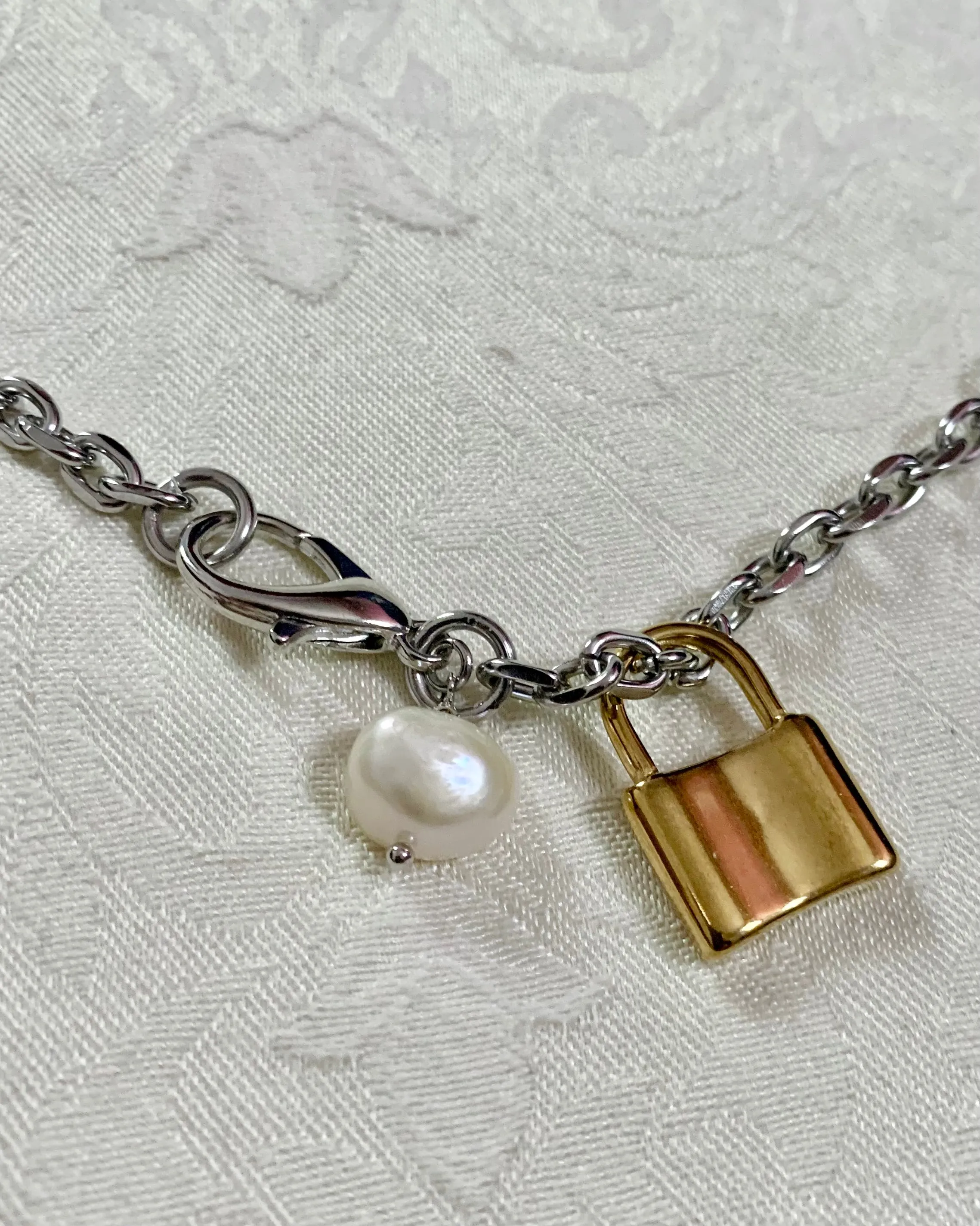 Simple pearl + lock charm necklace